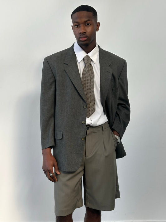 Yves Saint Laurent 1990s pure wool single-breasted blazer in size 46R, tailored fit, dark color, and classic lapel design.