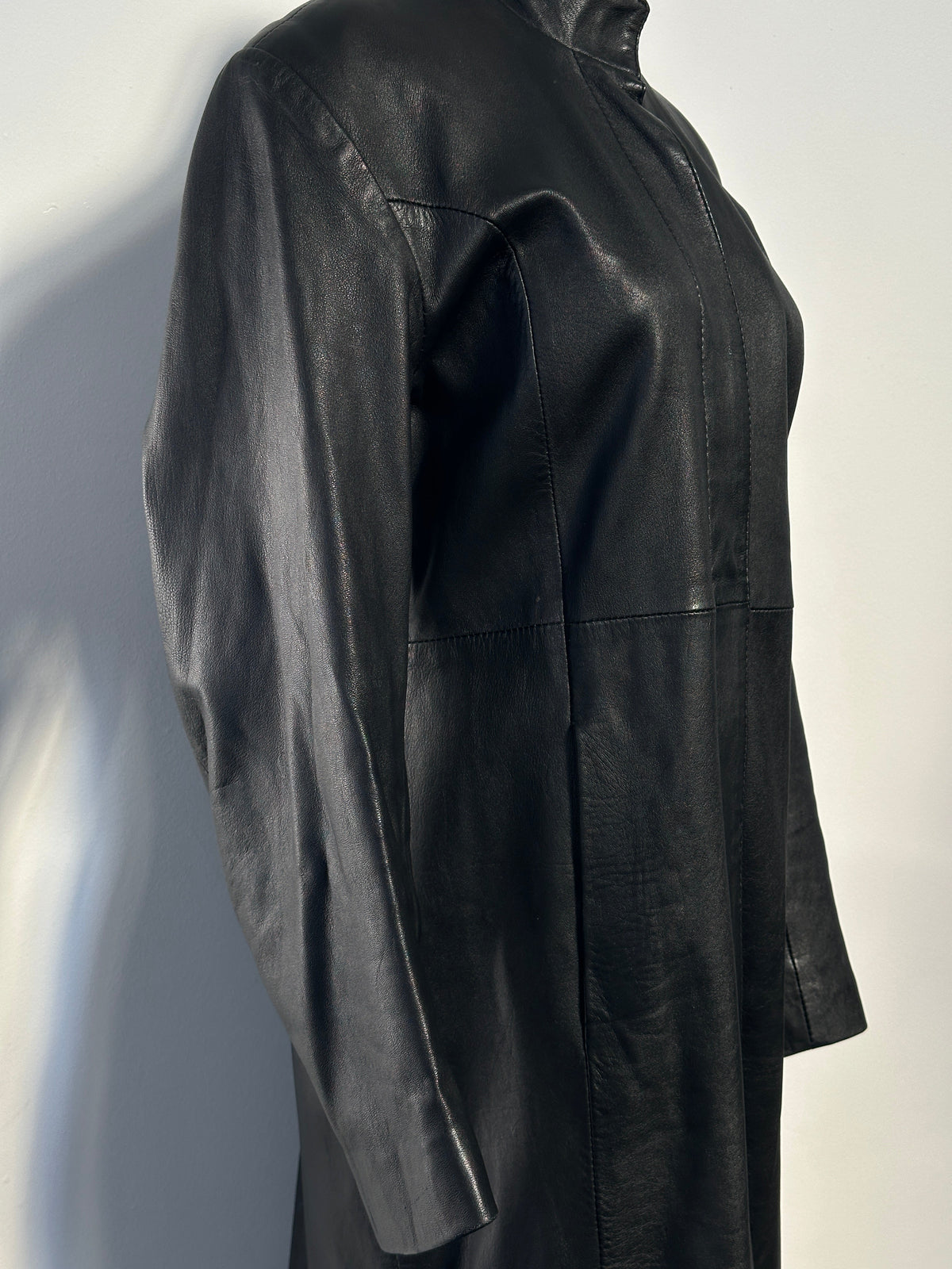 Vintage 1990s floor length leather trench coat, size small, featuring classic design and rich leather texture.