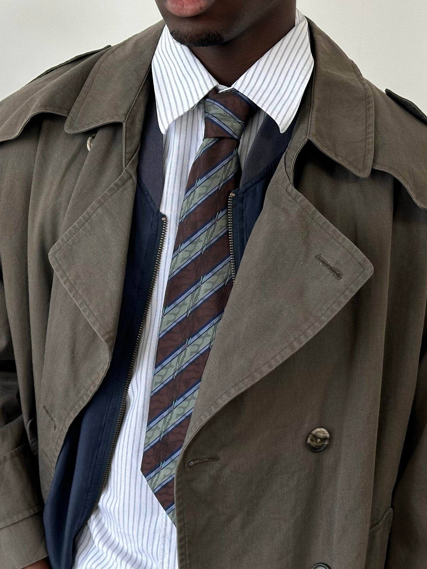 Vintage 1980s diagonal striped tie with bold pattern and classic style, featuring vibrant colors and a traditional tie shape.