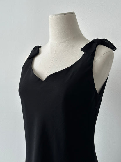 Vintage 1990s layered sleeveless midi dress in soft fabric, with a vintage-inspired design and a fitted bodice.