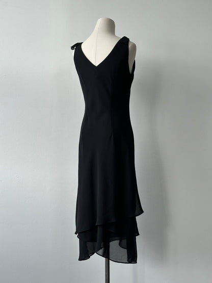 Vintage 1990s layered sleeveless midi dress in size S, showcasing a retro-inspired design with a flowing silhouette.