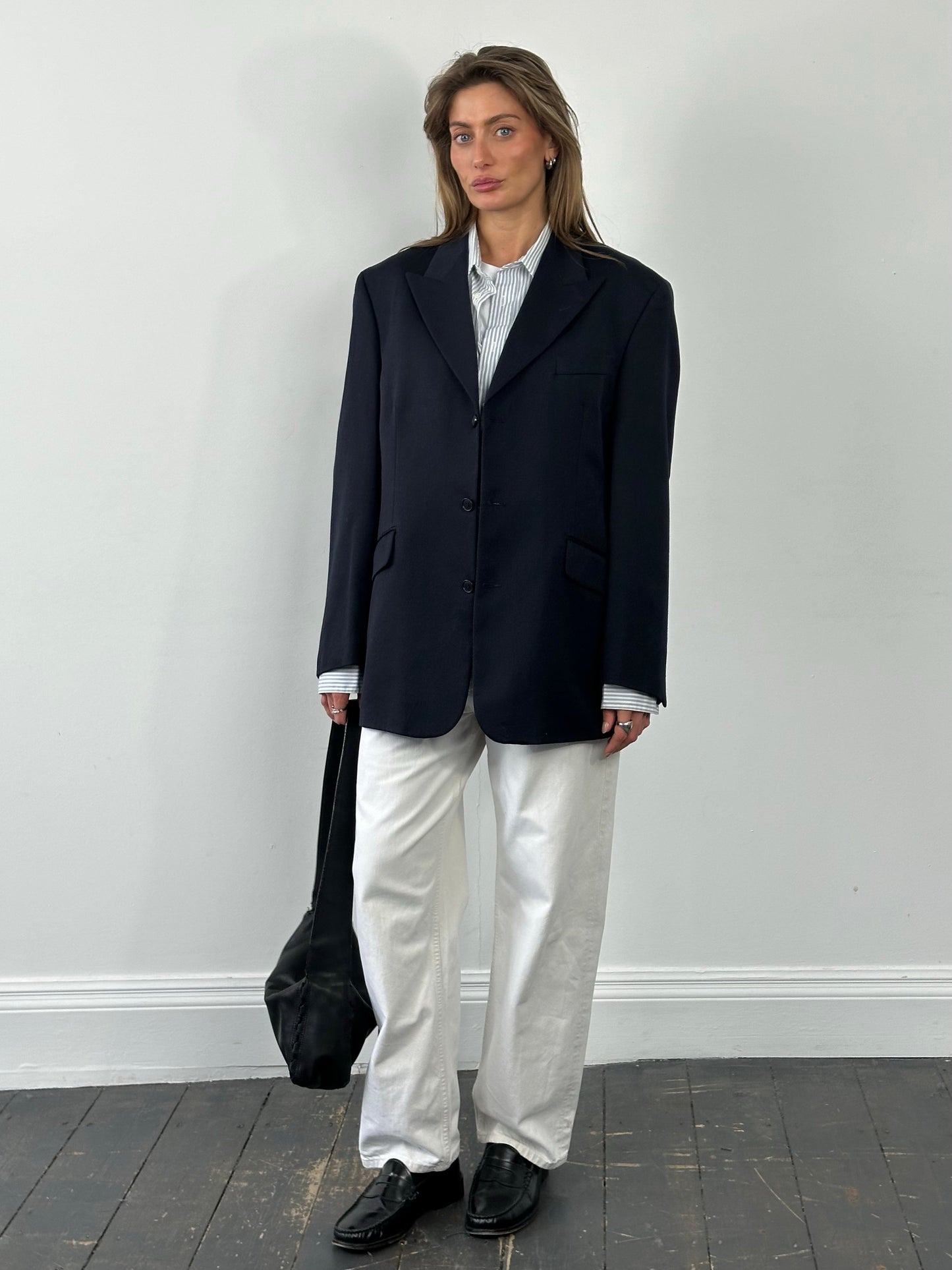 Yves Saint Laurent Pour Homme 1990s pure wool single-breasted blazer in size L/XL, shown on a hanger, classic men's fashion style.
