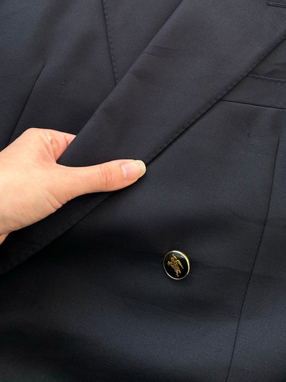 Burberry 1990s bespoke wool double-breasted blazer in size 42R/XL, featuring classic tailored design with buttons and structured fit.
