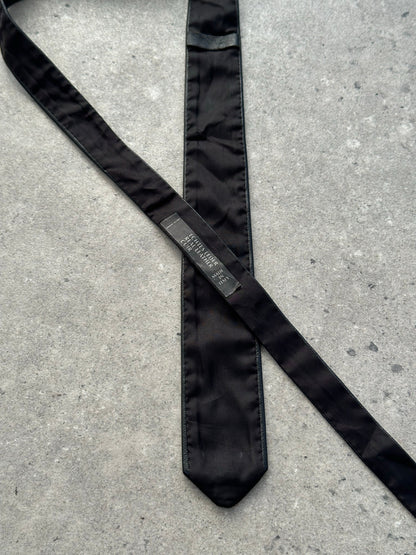 Vintage Italian 1990s slim leather tie with sleek design and rich brown color, perfect for sophisticated formal wear.