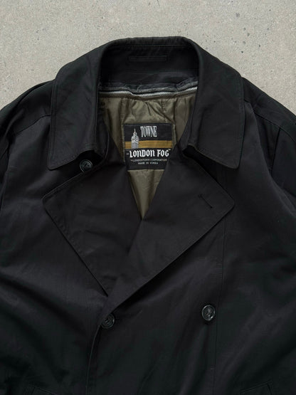 London Fog Towne 1990s double-breasted belted trench coat hanging with a classic design and neutral color.