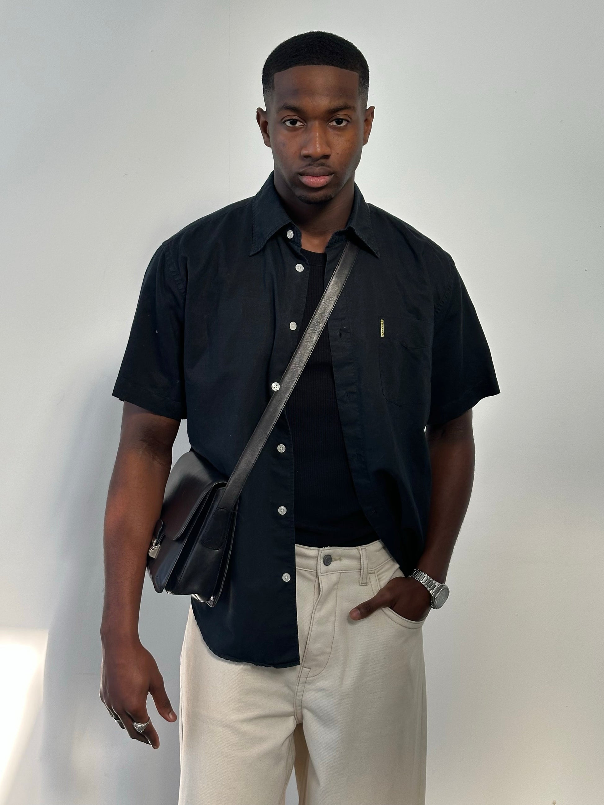 Armani Jeans 1990s pure cotton short sleeve shirt in navy blue, featuring a classic collar and button-front design.