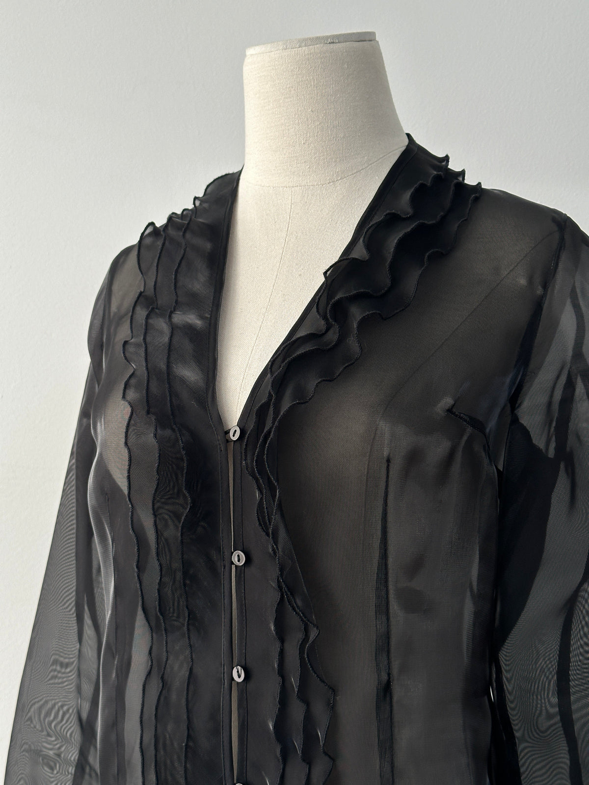 Vintage 1990s sheer ruffle shirt in size small, featuring lightweight fabric, feminine ruffles, and classic vintage style.
