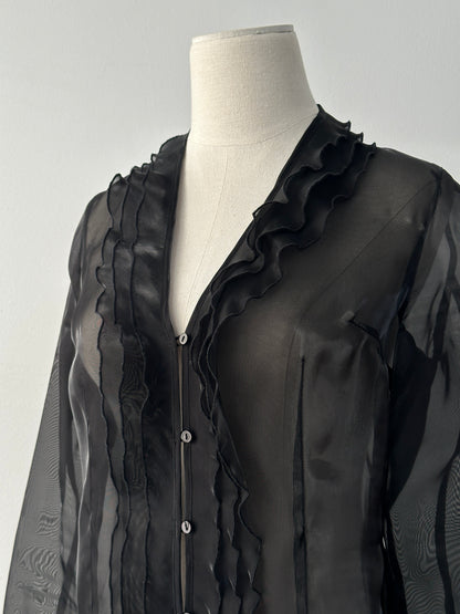 Vintage 1990s sheer ruffle shirt in size small, featuring lightweight fabric, feminine ruffles, and classic vintage style.