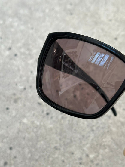 Dolce & Gabbana 2000s rectangle logo sunglasses with dark tinted lenses and stylish black frames.