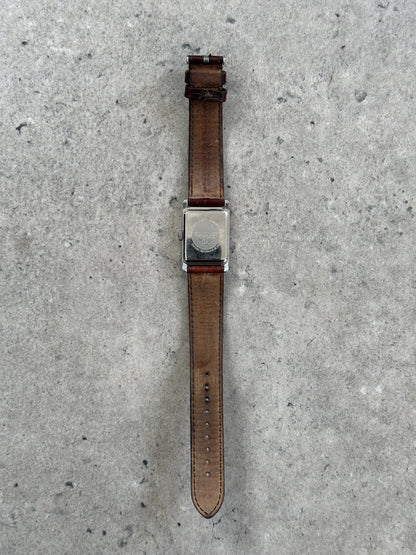 Emporio Armani 2000s leather rectangular quartz watch with silver dial and black leather strap, showcasing a classic fashion accessory.
