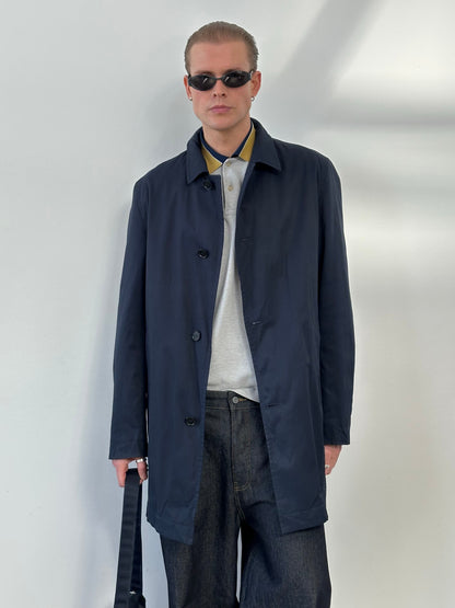 Hugo Boss 2000s cotton water-repellent trench coat in size L, beige color, shown on a hanger with a classic collar and button details.