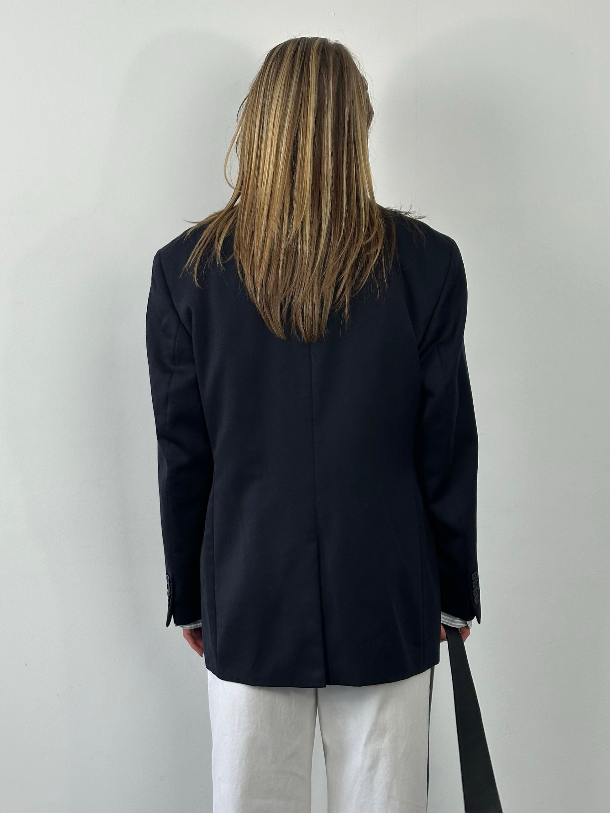 Yves Saint Laurent 1990s pure wool single-breasted blazer in size L/XL, tailored fit with classic lapel and button closure.