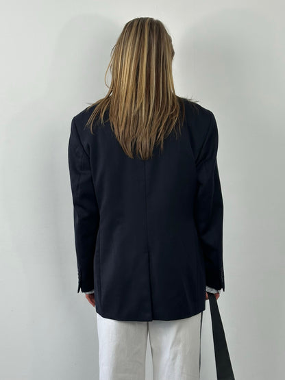 Yves Saint Laurent 1990s pure wool single-breasted blazer in size L/XL, tailored fit with classic lapel and button closure.