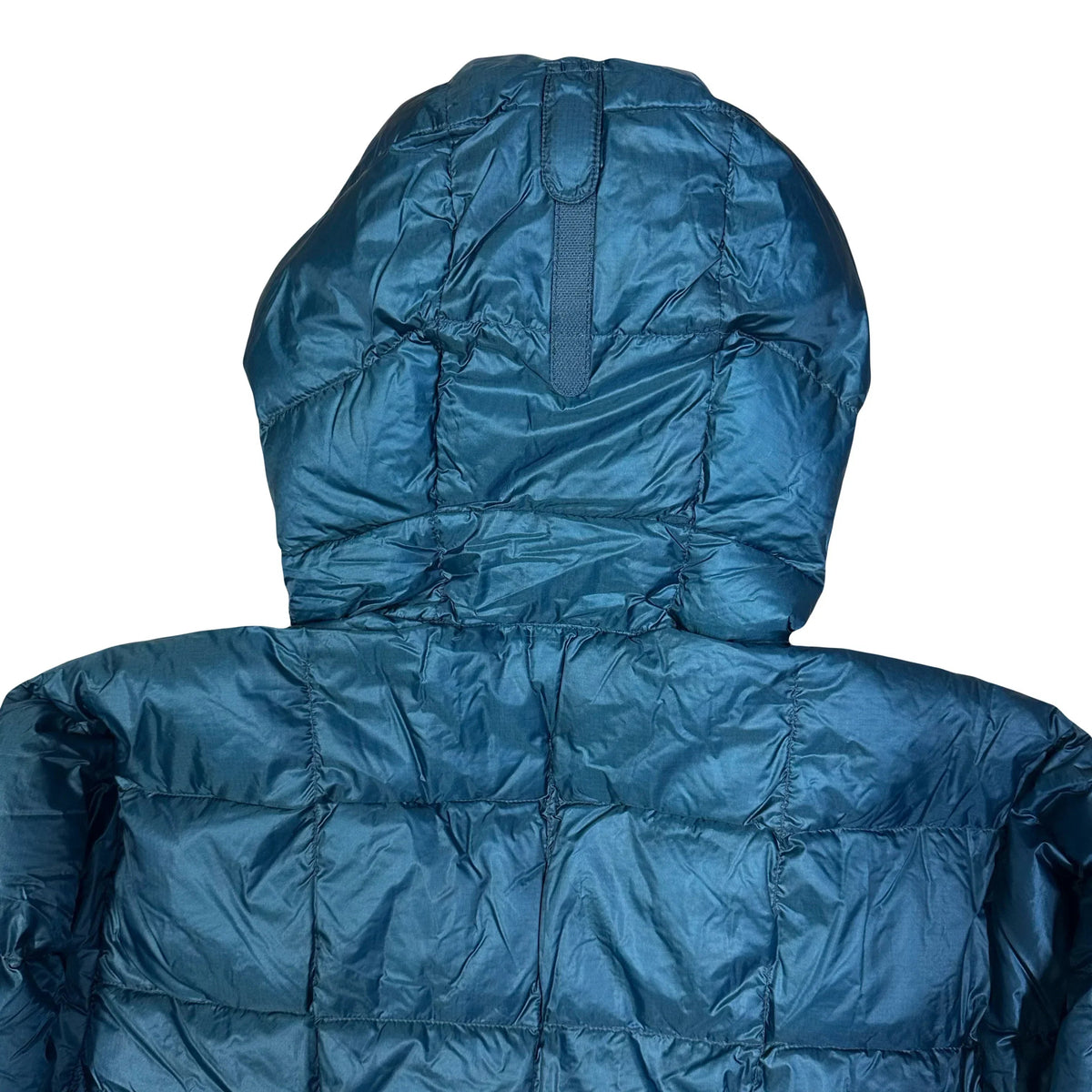 Rear view of the hood and upper back of a blue Montbell Superior Down Parka puffer jacket.