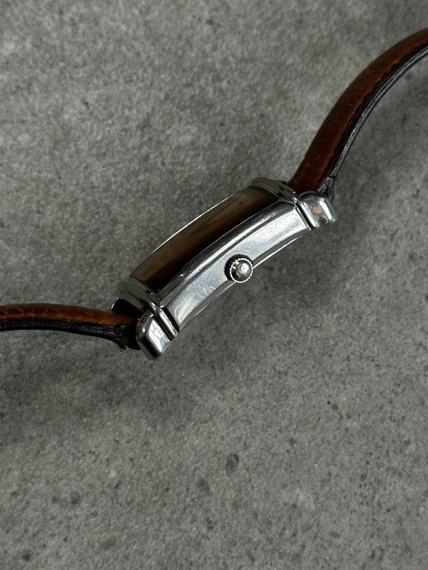 Emporio Armani 2000s leather watch with round dial and black leather strap, showcasing classic elegance and sophisticated style.