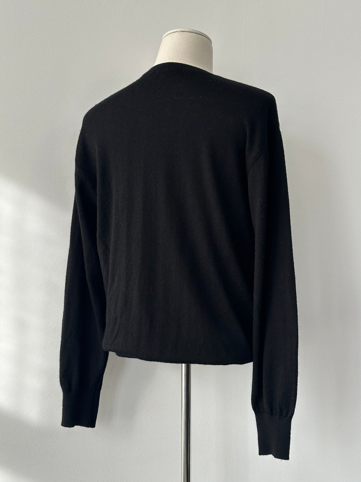 Yves Saint Laurent 1990s pure wool V-neck jumper in size M, featuring a classic design and soft wool texture.
