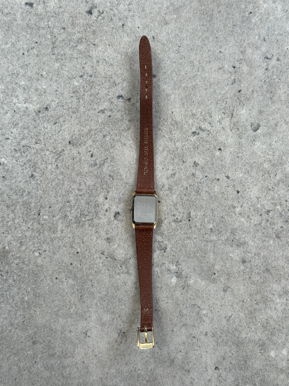 Vintage Pulsar 1980s gold tone leather watch with round dial and classic design, featuring leather strap and vintage detailing.