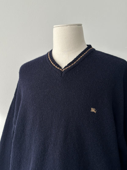 Burberry 1990s pure wool V-neck jumper in XL, featuring classic design and beige color, displayed on a neutral background.