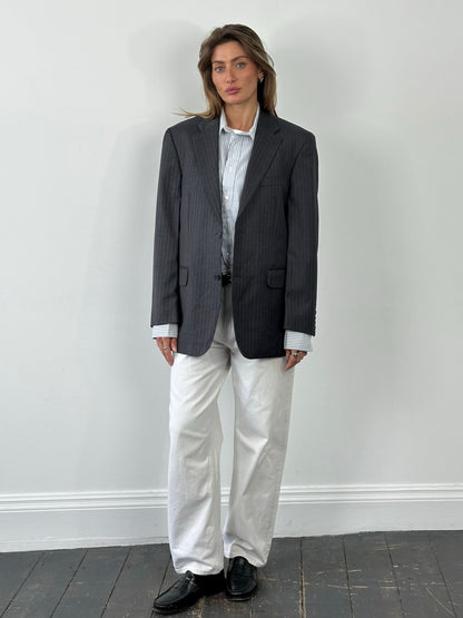 Loro Piana x Digel 1990s pure wool single-breasted blazer in size L, tailored fit, dark color, with classic lapel and button closure.