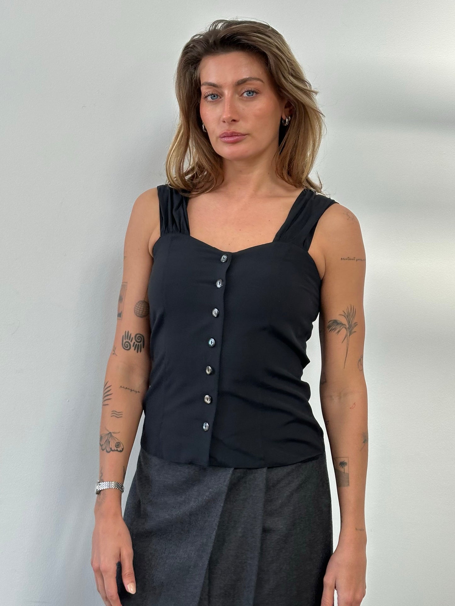 Vintage 1990s button-down sweetheart neckline top, size small, with long sleeves and vintage fabric, casual chic style.