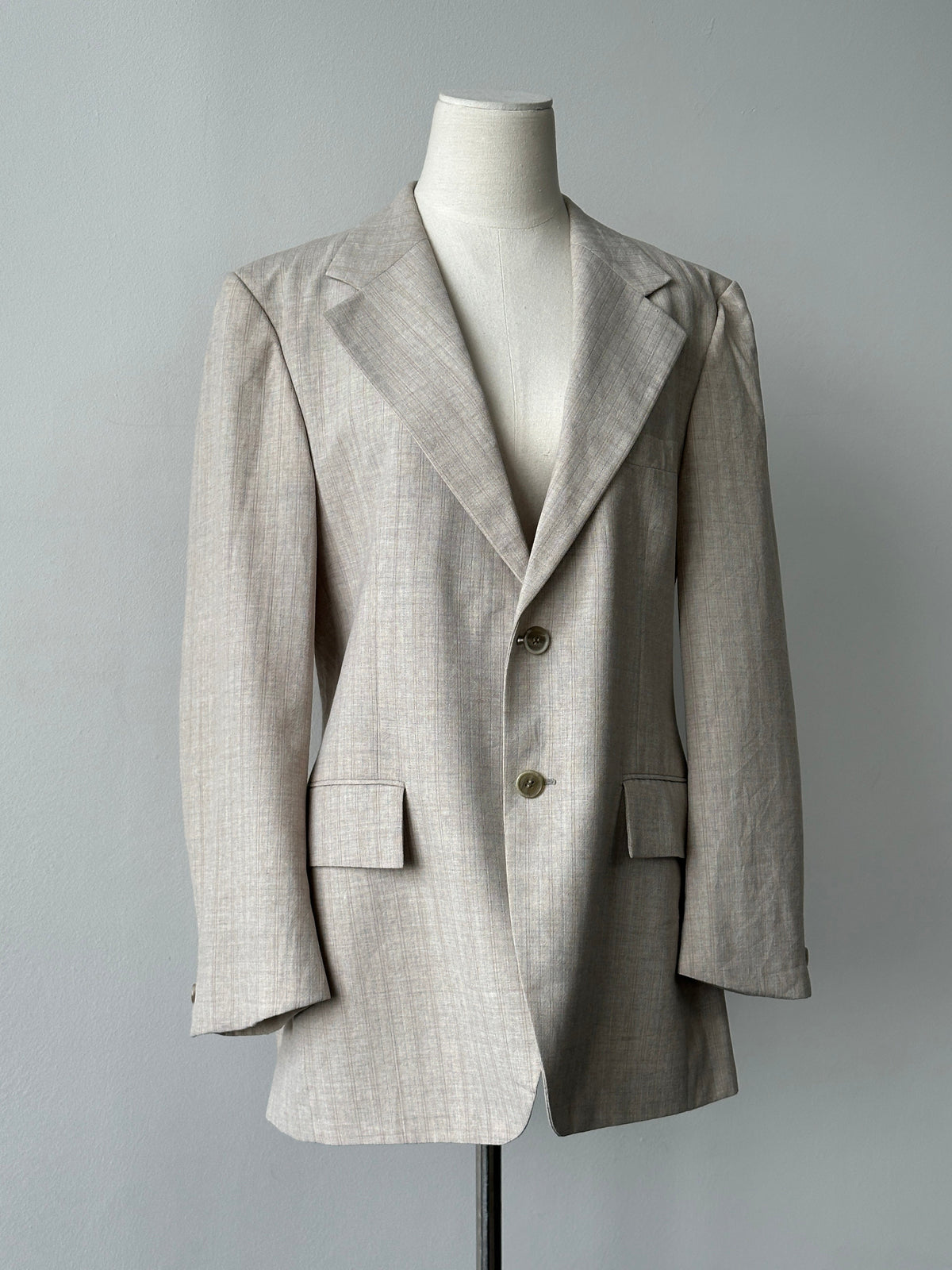 Yves Saint Laurent 1980s wool stripe single-breasted blazer in size M, featuring classic tailored fit and bold stripe pattern.