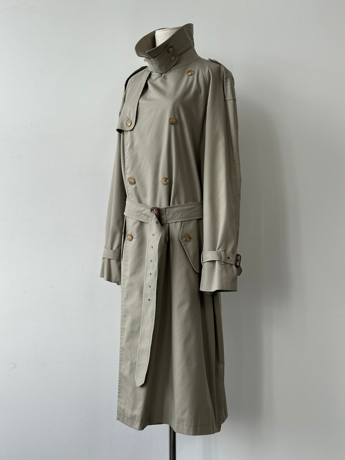 Vintage Italian 1990s high neck belted trench coat in XL, showcasing classic design, high collar, and belt detail on a neutral background.