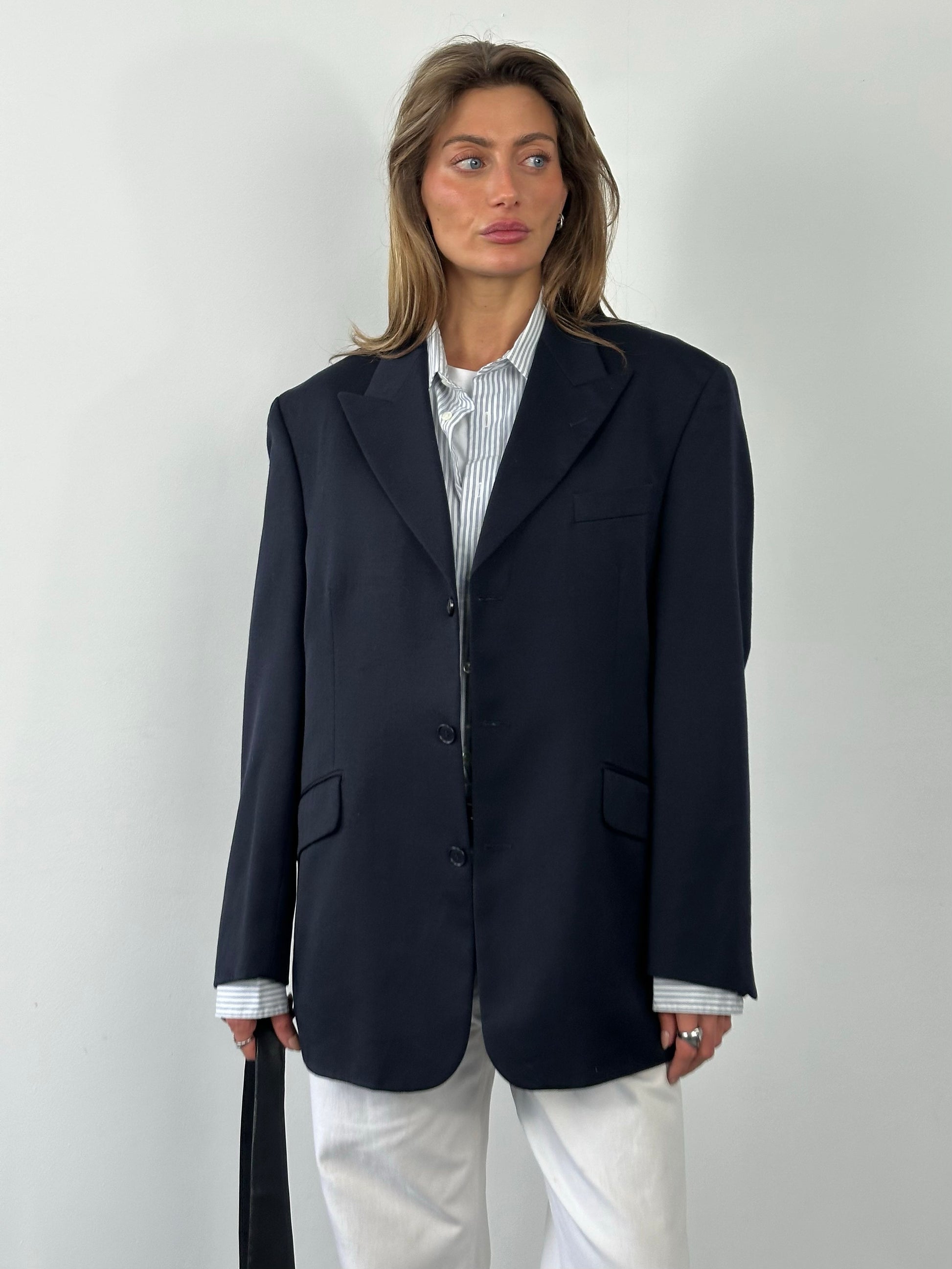 Yves Saint Laurent 1990s pure wool single-breasted blazer in size L/XL, tailored fit, navy color, with classic lapel and button details.