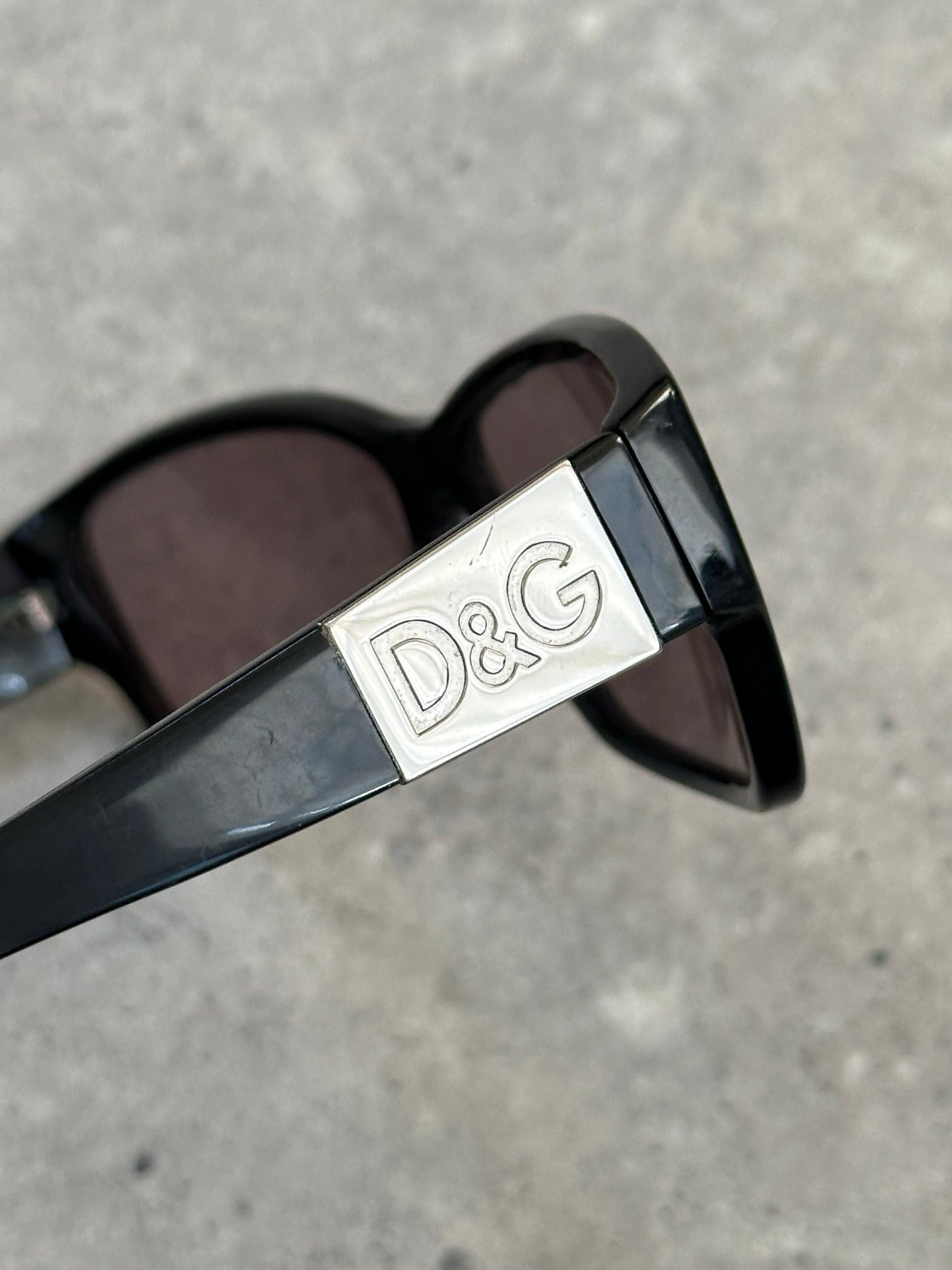 Dolce & Gabbana 2000s rectangle logo sunglasses with black frames and tinted lenses, stylish and iconic designer eyewear.