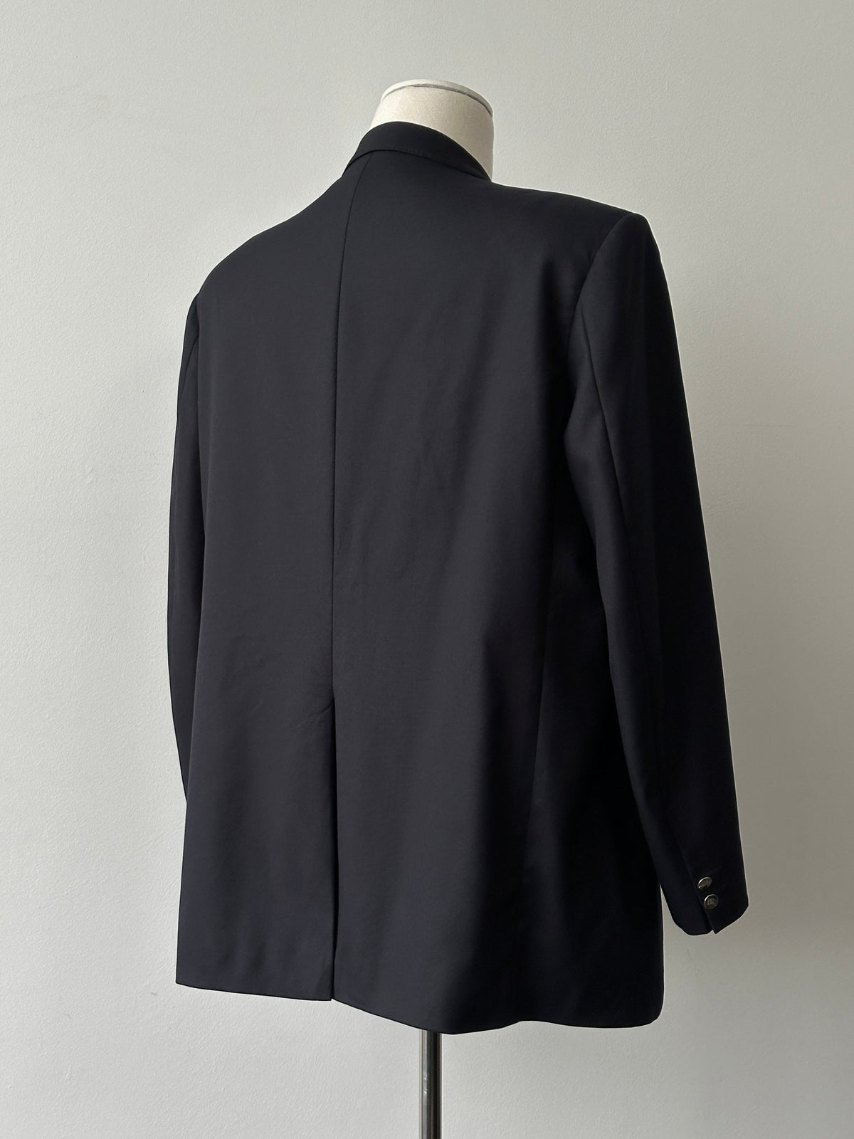 Burberry 1980s pure wool double-breasted blazer, size 46R, with classic tailored fit and signature check lining visible.