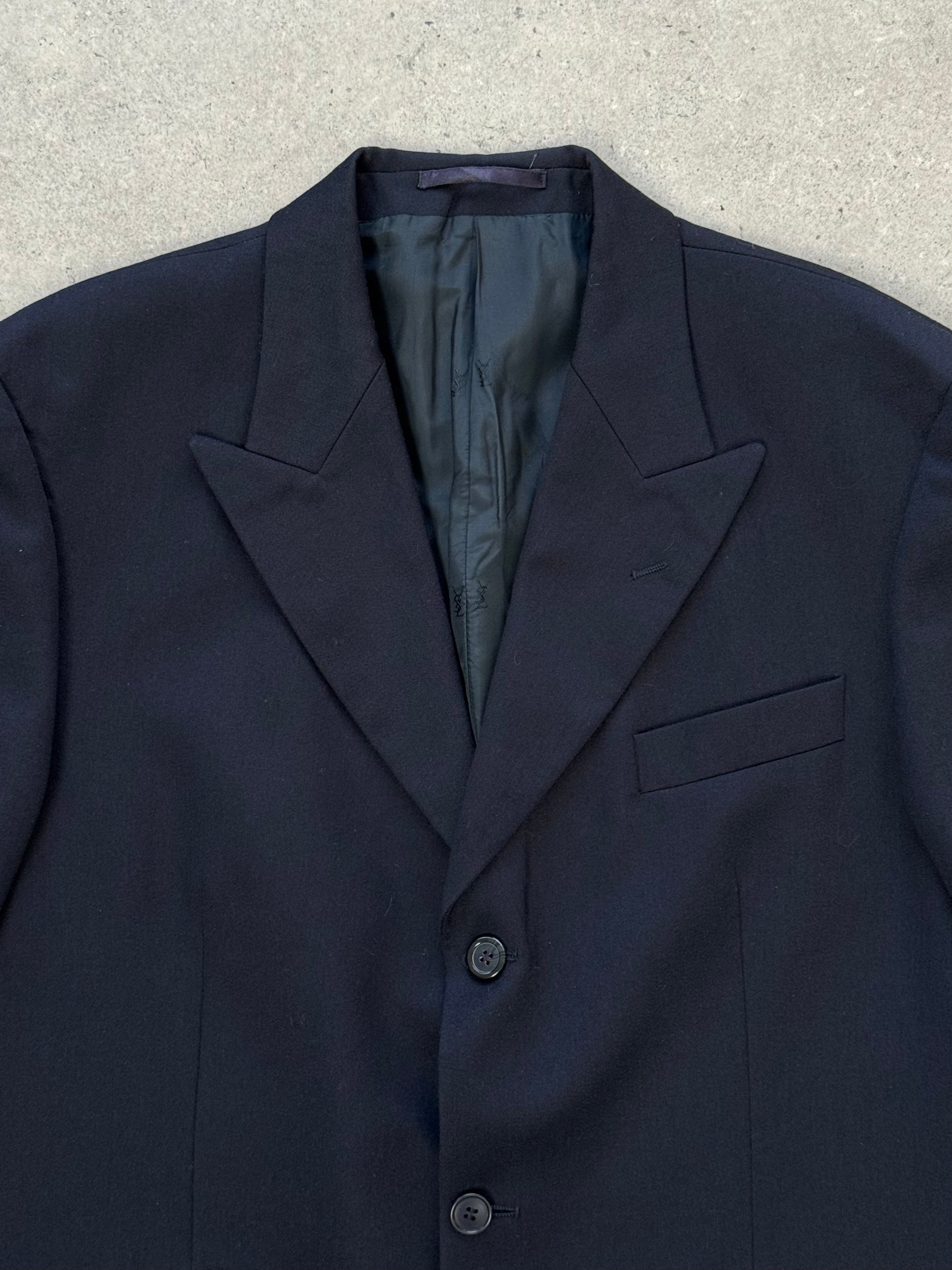 Yves Saint Laurent 1990s pure wool single-breasted blazer in size L/XL, shown in classic dark color, tailored fit with lapel collar.