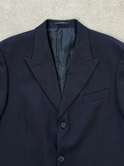 Yves Saint Laurent 1990s pure wool single-breasted blazer in size L/XL, shown in classic dark color, tailored fit with lapel collar.