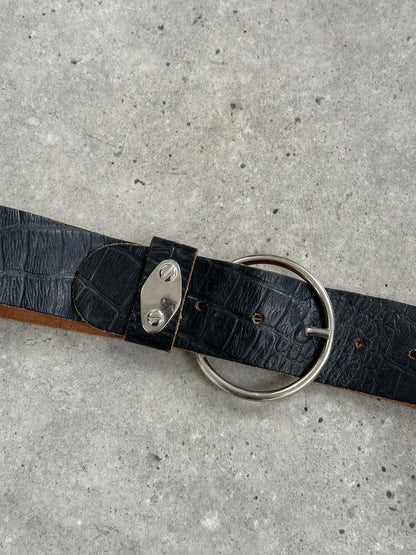 Vintage 1990s circular leather chunky belt with bold design, featuring a large circular buckle and distressed leather finish.