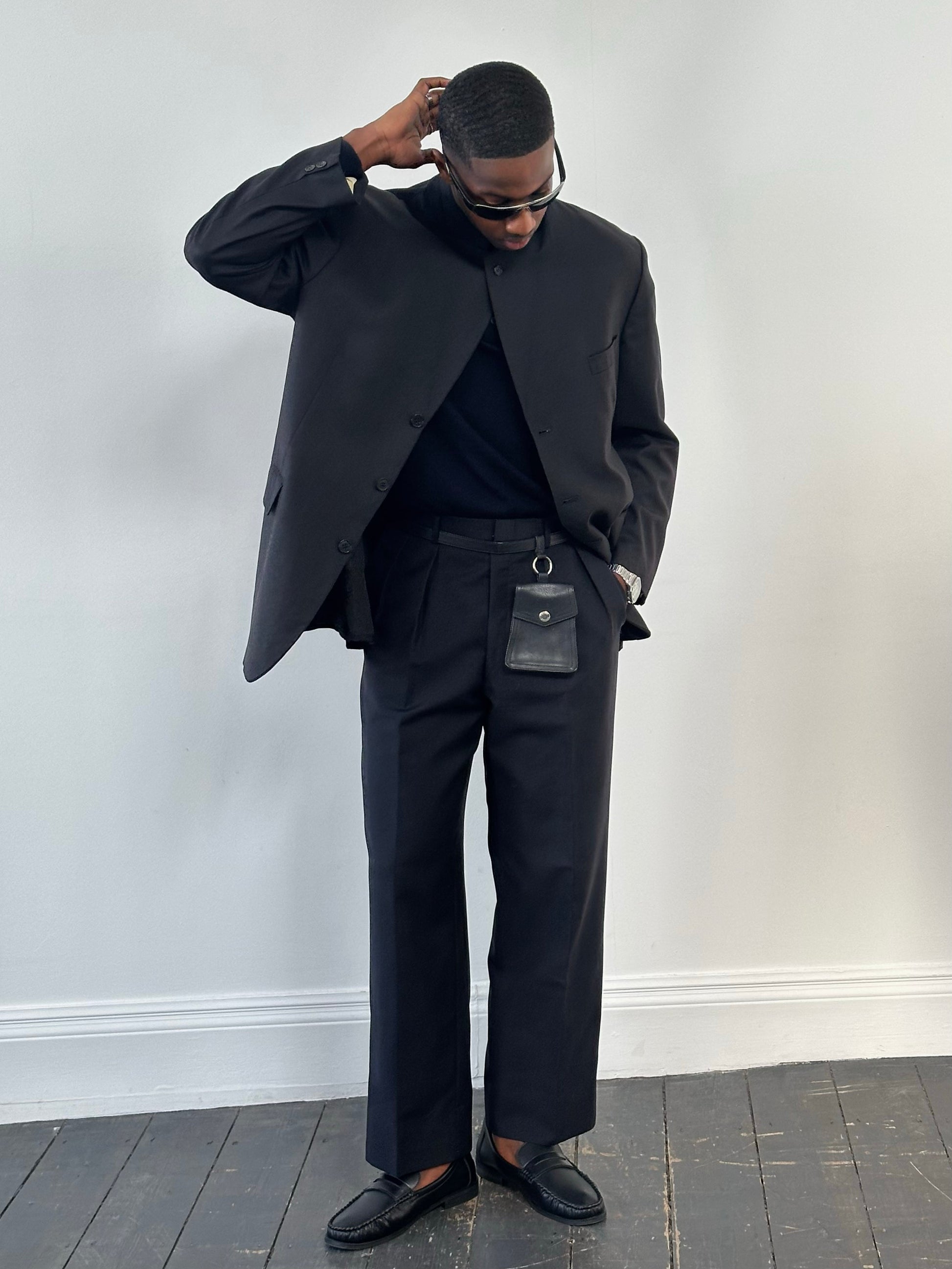 Vintage 1990s wool mohair pleated trousers in size W34, showcasing classic high-waisted design and tailored fit.