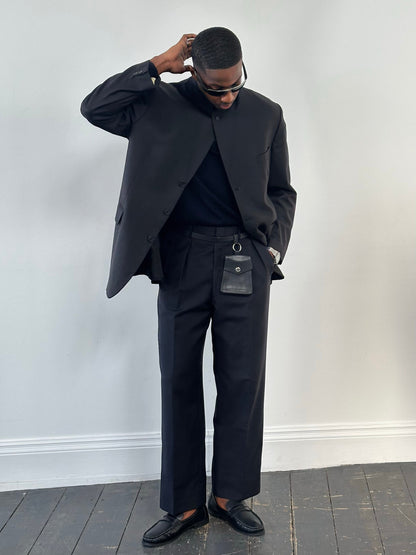 Vintage 1990s wool mohair pleated trousers in size W34, showcasing classic high-waisted design and tailored fit.