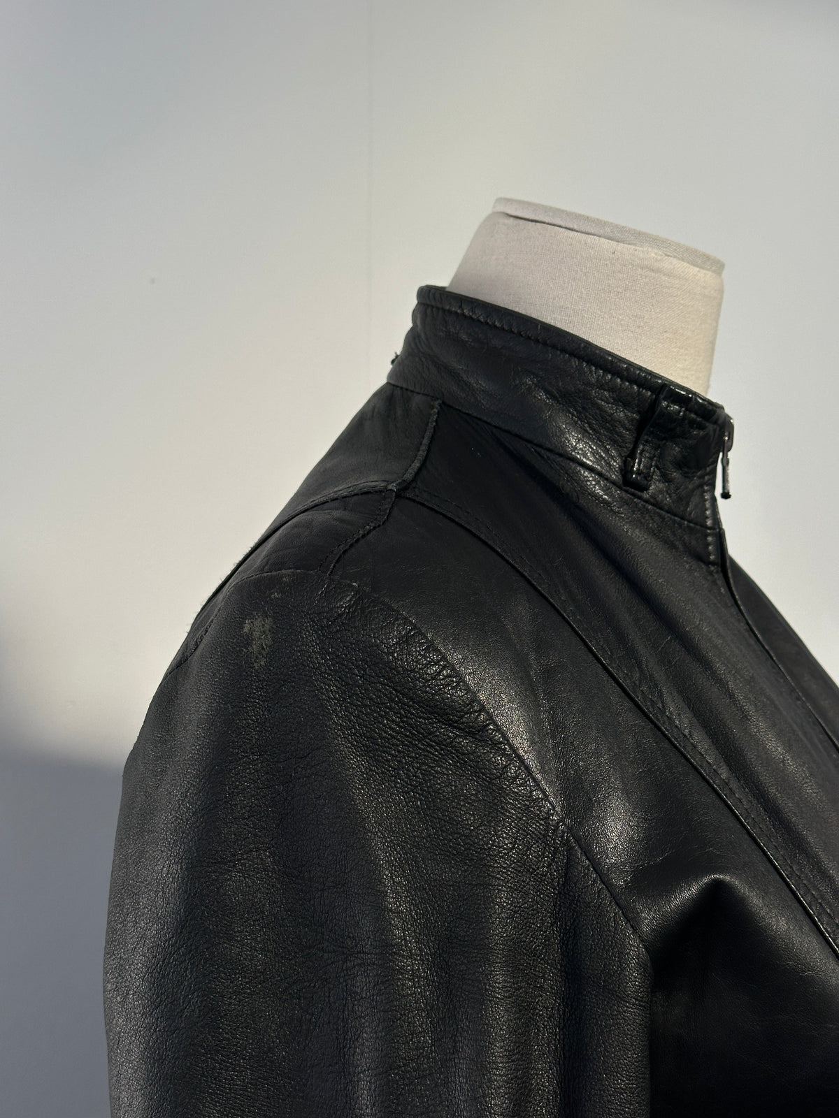 Italian vintage 1990s double zip belted leather jacket, XS, featuring classic design and rich leather texture.