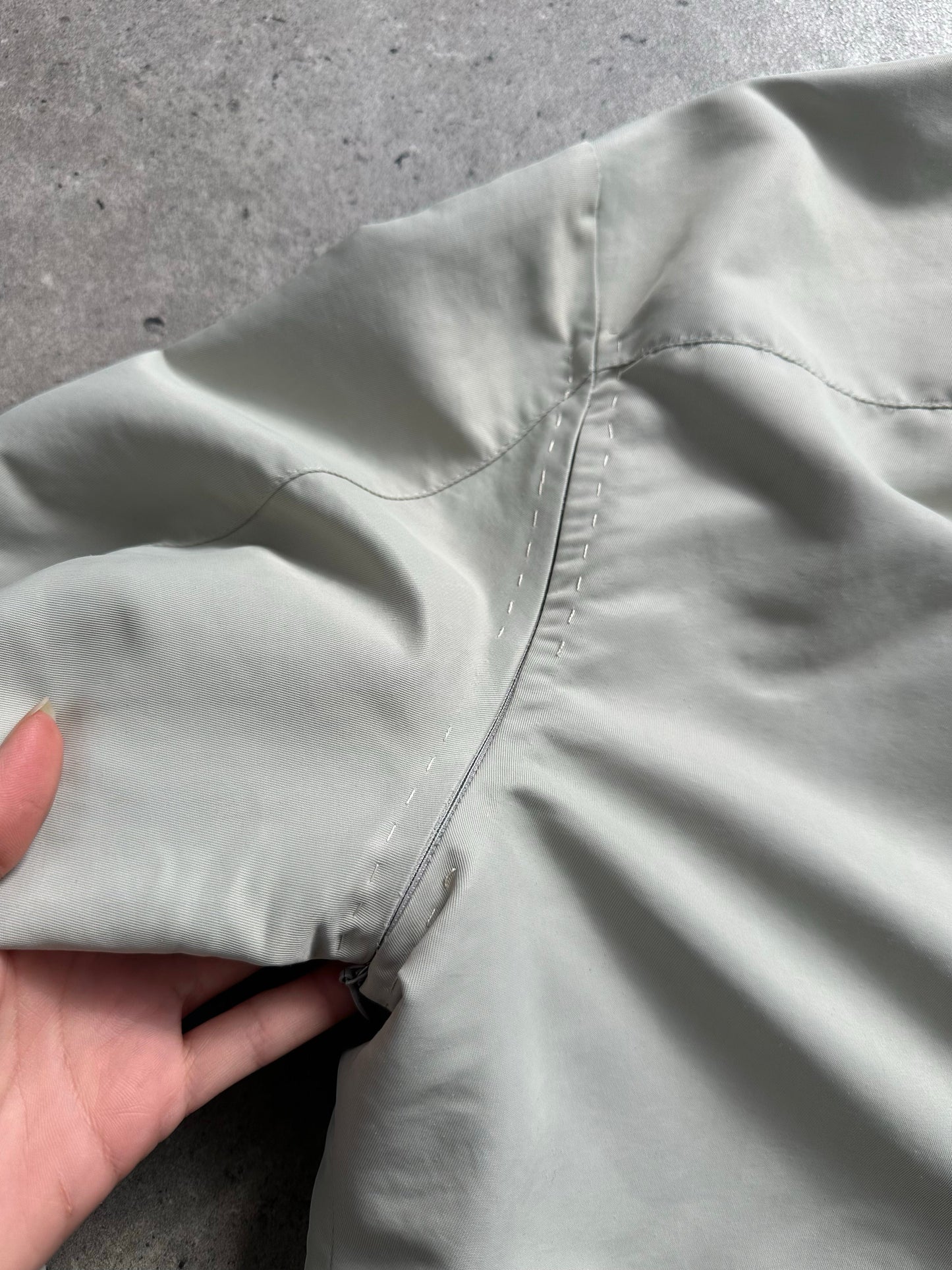 Gianfranco Ferre 1990s showerproof minimal jacket in size L, lightweight jacket with sleek design and waterproof fabric.