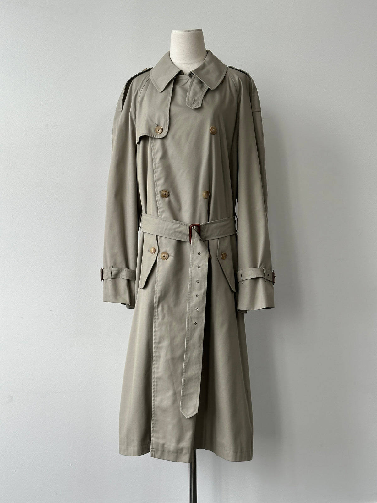 Italian vintage 1990s high neck belted trench coat in XL, showcasing classic design and fabric details on a neutral background.