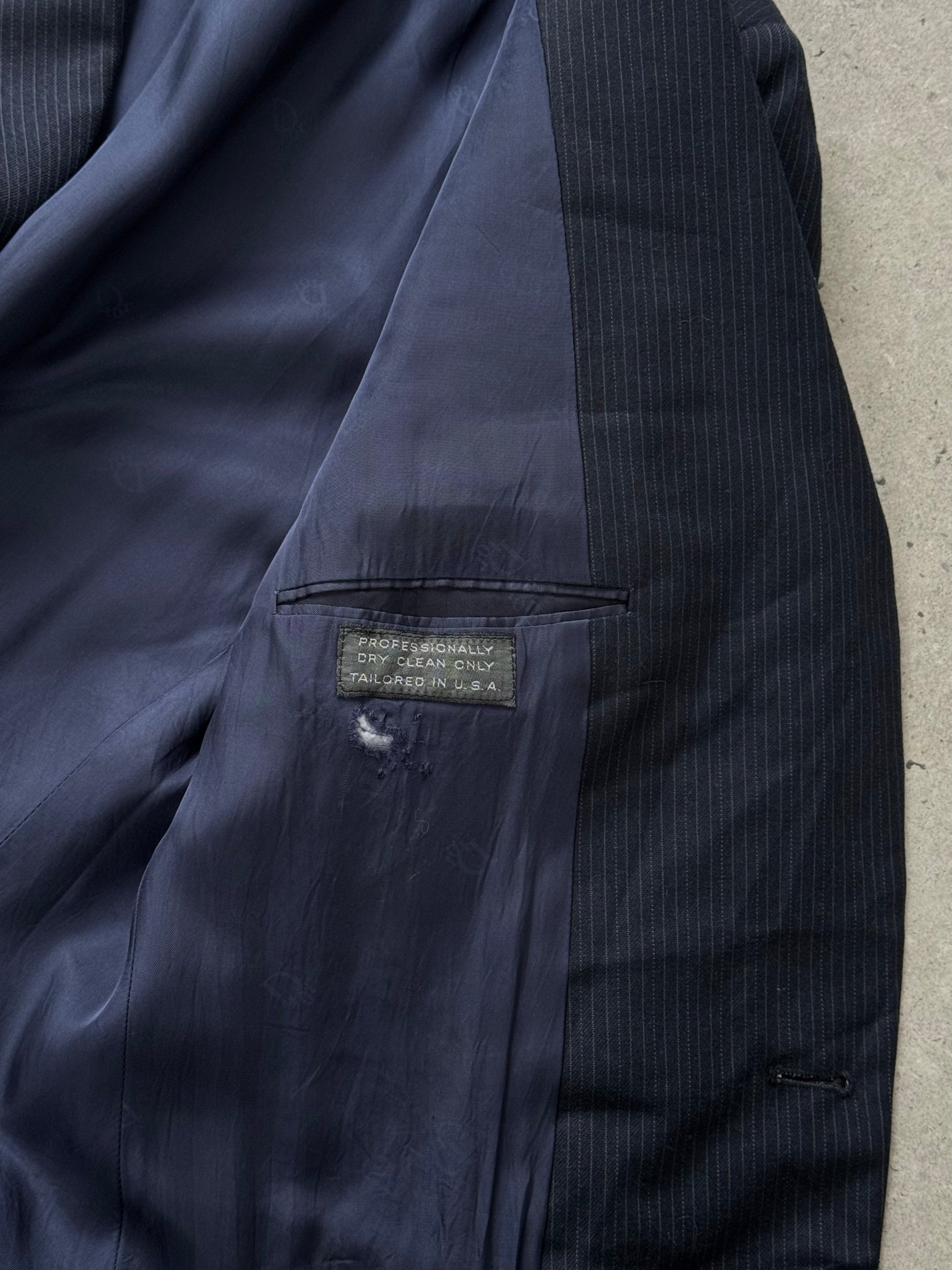 Christian Dior Monsieur 1980s wool striped blazer, size 40R, shown on a hanger with navy and gray striped fabric.