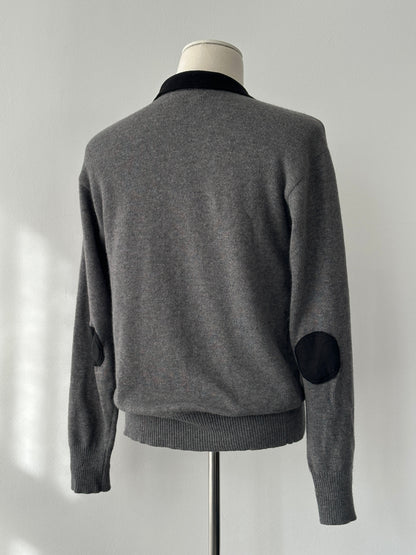 Yves Saint Laurent 1990s wool polo jumper in navy, featuring classic collar and ribbed cuffs, size S-M, displayed on a mannequin.