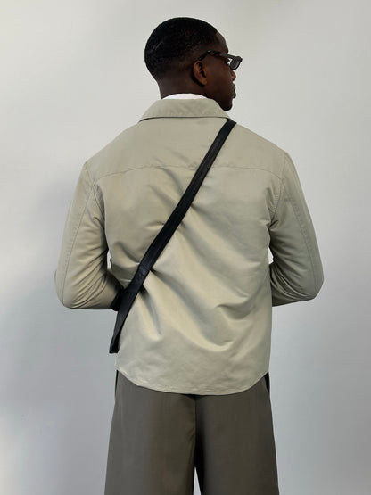 Gianfranco Ferre 1990s showerproof minimal jacket in size L, featuring sleek design and lightweight fabric, front view.