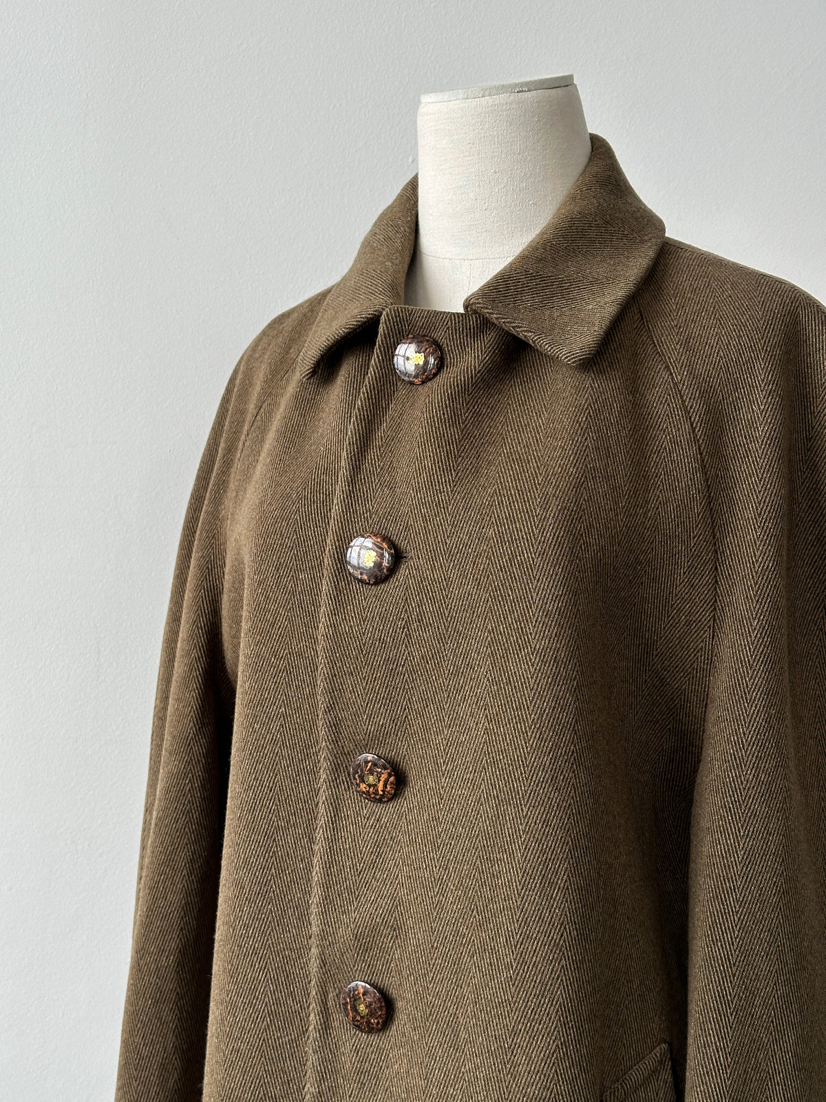 Vintage Italian 1990s wool herringbone single-breasted coat, size large, featuring classic tailored design and textured fabric.