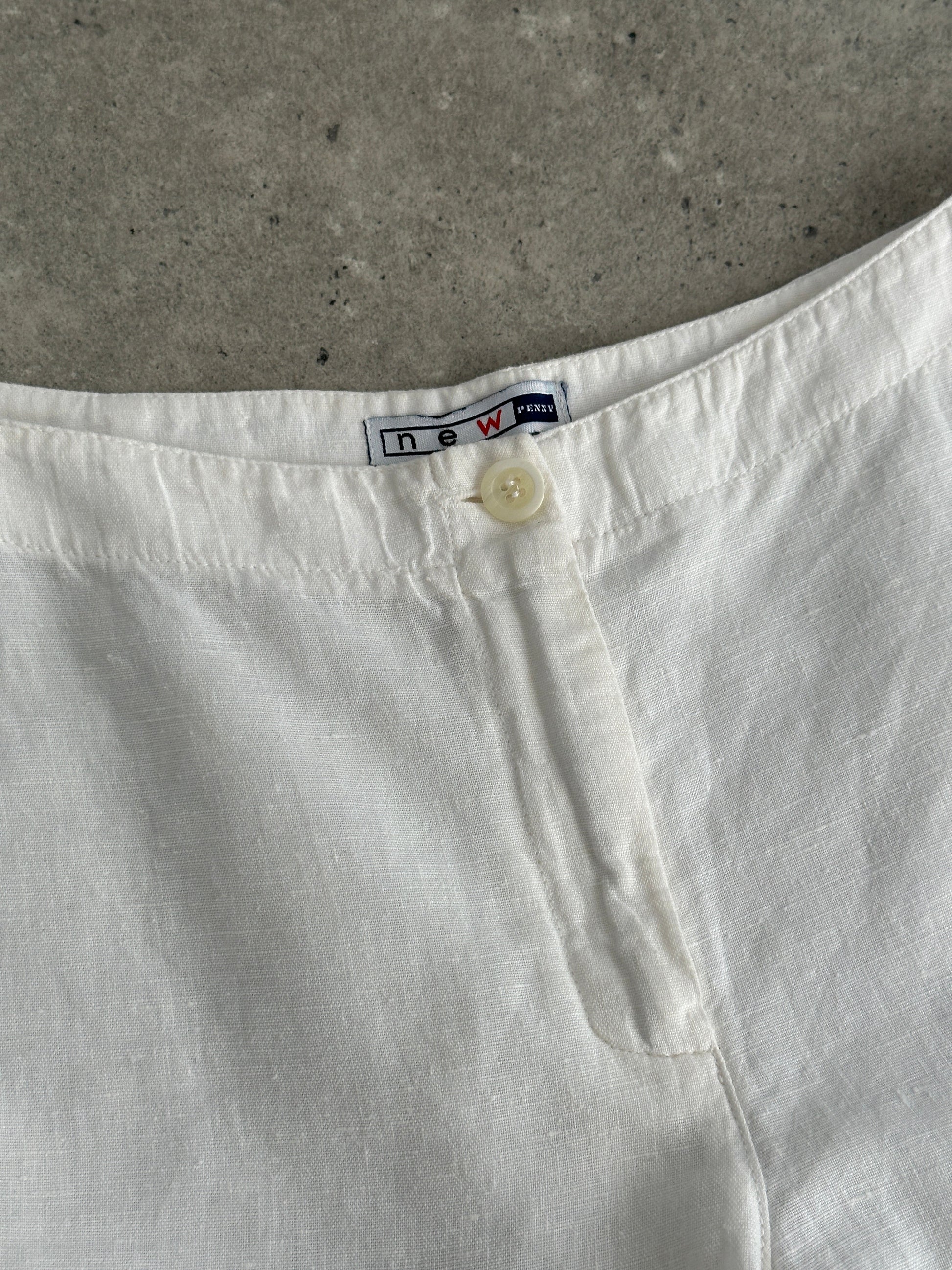 Vintage pure linen low waist wide-leg trousers with relaxed fit, shown in natural fabric detail and classic styling.