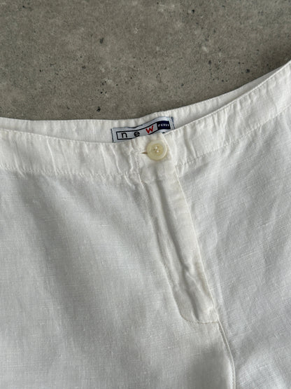 Vintage pure linen low waist wide-leg trousers with relaxed fit, shown in natural fabric detail and classic styling.