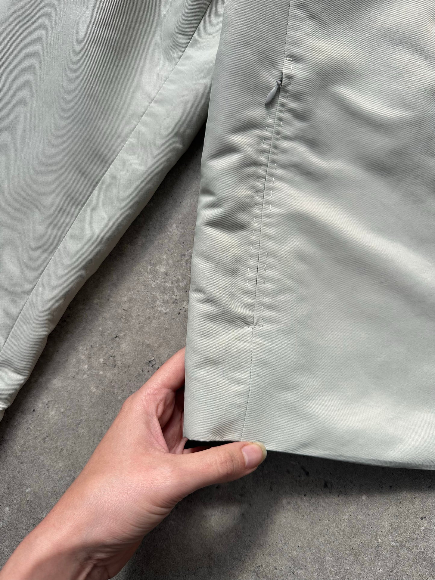 Gianfranco Ferre 1990s showerproof minimal jacket in size L, featuring sleek design and lightweight fabric.
