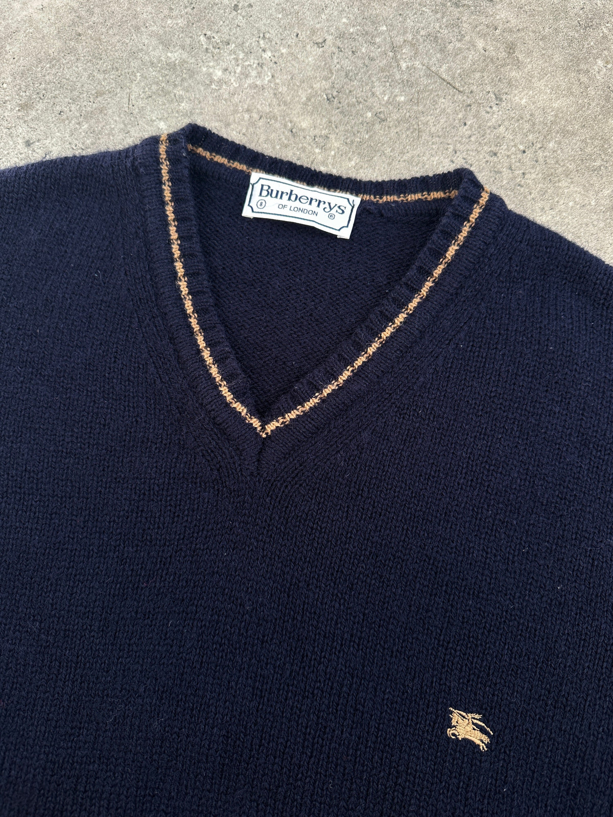 Burberry 1990s pure wool V-neck jumper in XL, featuring classic design and soft wool texture, displayed on a neutral background.