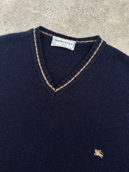 Burberry 1990s pure wool V-neck jumper in XL, featuring classic design and soft wool texture, displayed on a neutral background.