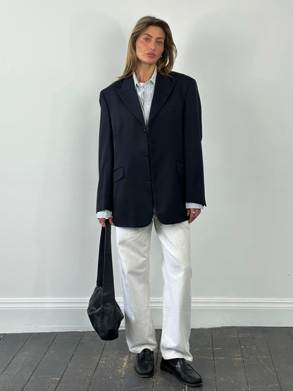 Yves Saint Laurent 1990s pure wool single-breasted blazer in L/XL, showing the tailored fit and classic design in a neutral color.