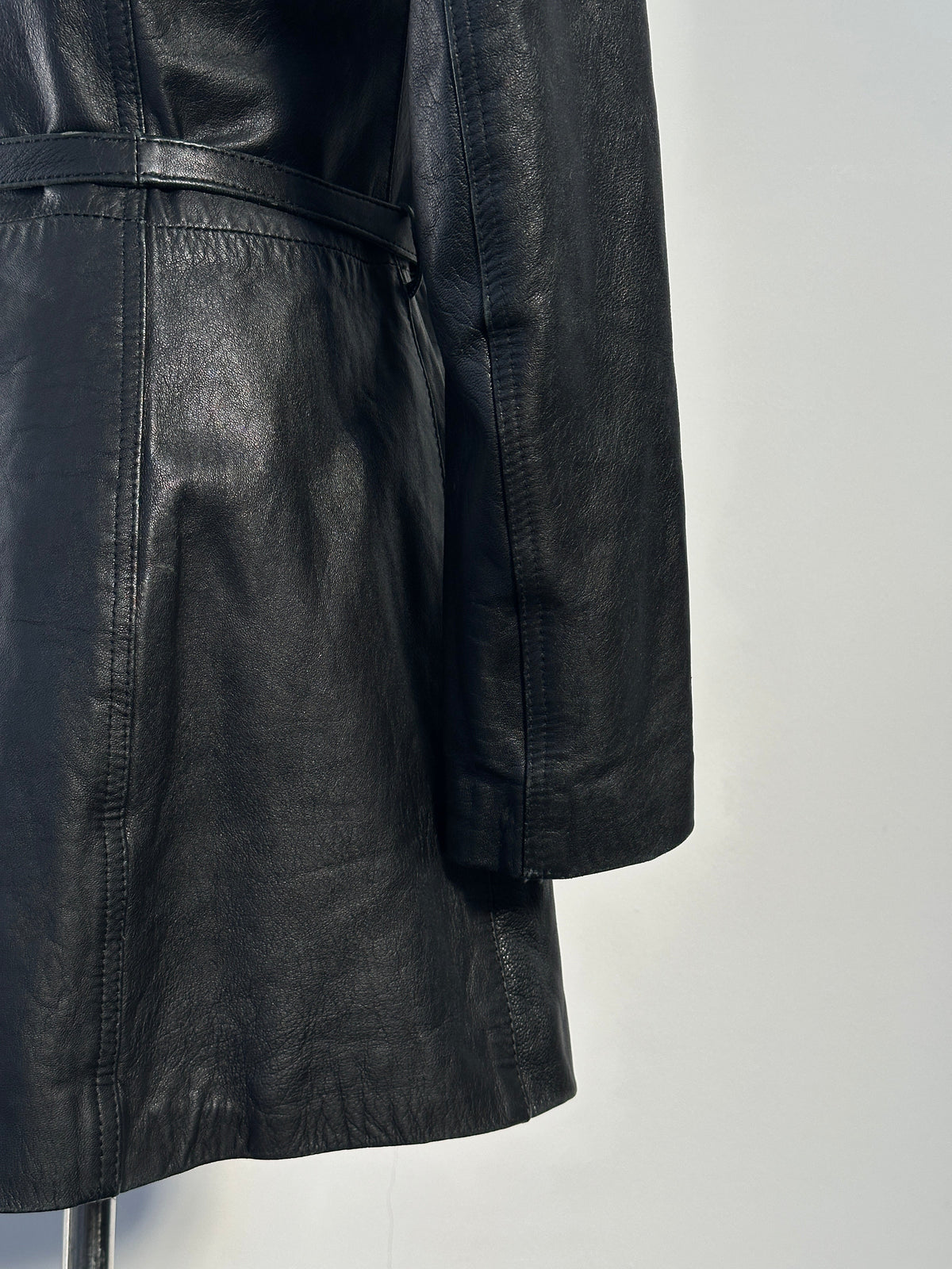 Vintage Italian 1990s double zip belted leather jacket, XS size, featuring classic design and authentic leather construction.