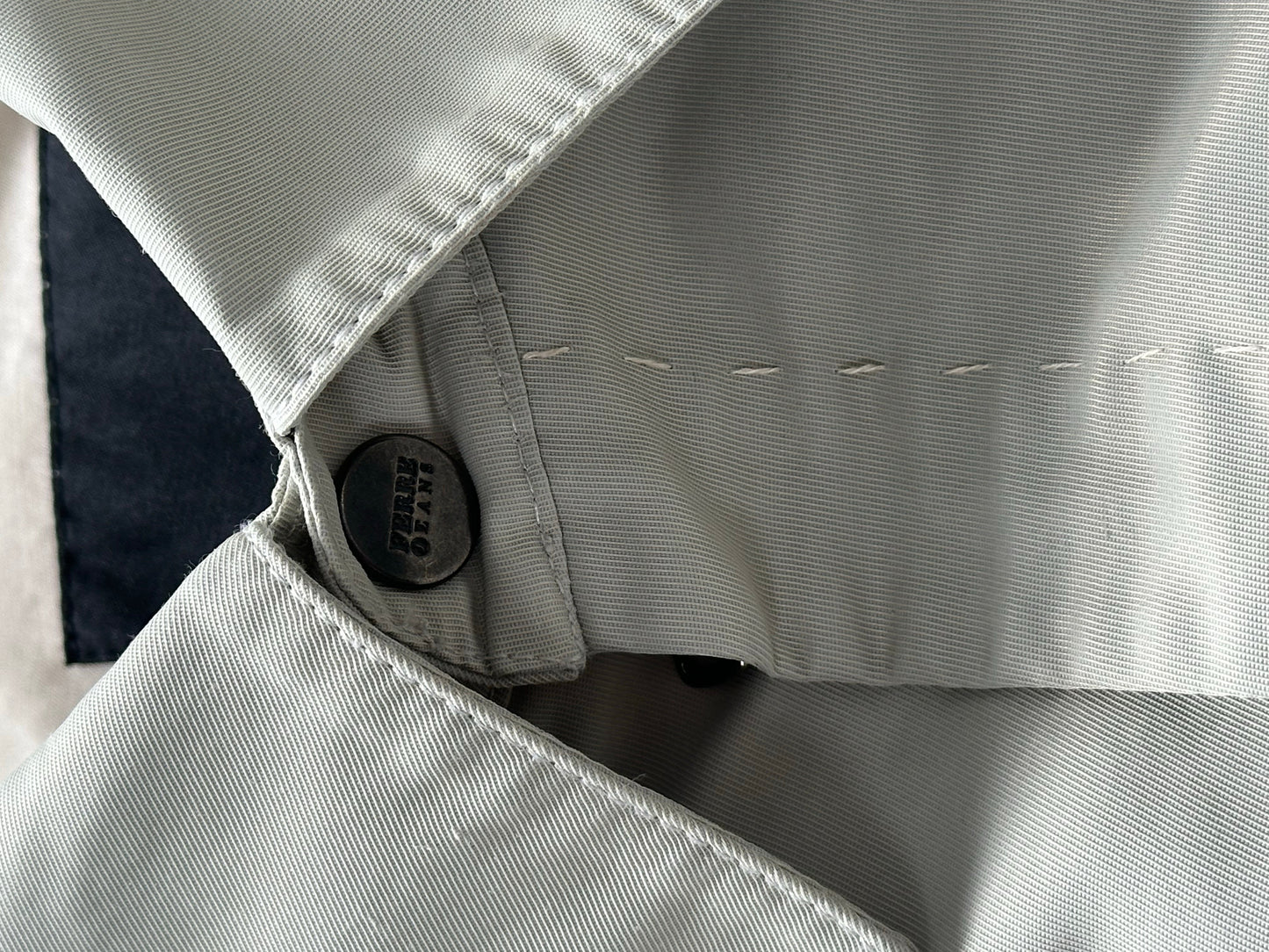 Gianfranco Ferre 1990s showerproof minimal jacket in size L, featuring sleek design and lightweight material, front view.
