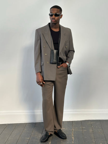 Yves Saint Laurent 1990s pure wool double-breasted blazer in classic style, featuring a tailored fit and button details.